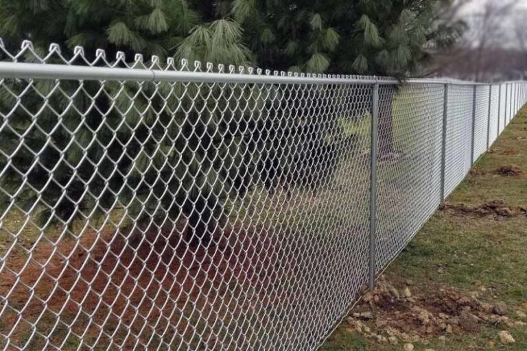Long perimeter galvanized chain link fence installed for a commercial commercial property border by NVS Fence & Landscape in Copperas Cove, TX